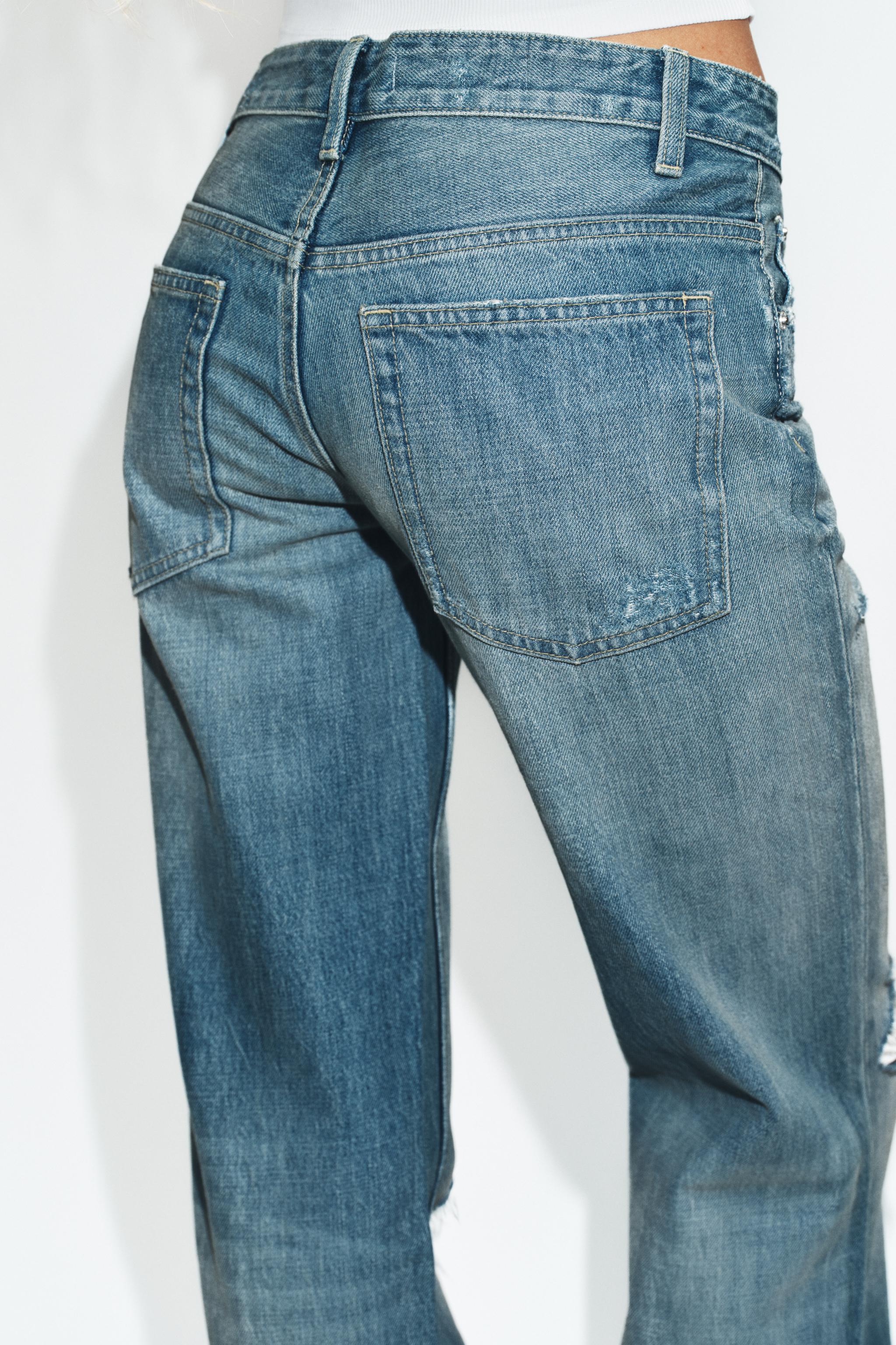 TRF FLARE RIPPED MID-RISE JEANS